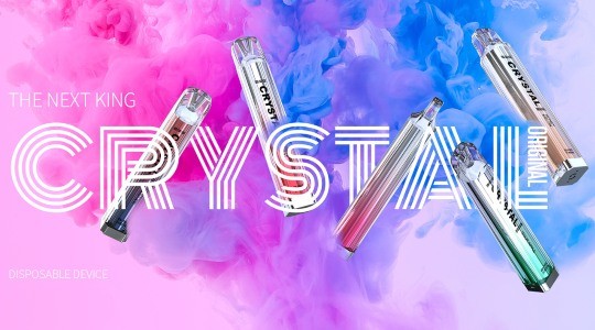 Five Crystal Bar vapes sit in front of a cloud of rainbow smoke, showing off the glass-style build and small size of the vapes.